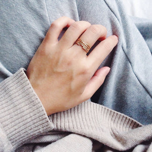 Skinny thin gold filled dainty rings in classic, twisted and hammered worn stacked together to form its own design