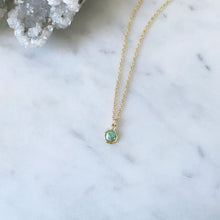 A modern gold Australian turquoise pendant on a fine gold cable chain