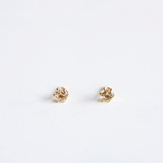 A pair of 3mm citrine gemstone stud earrings in gold