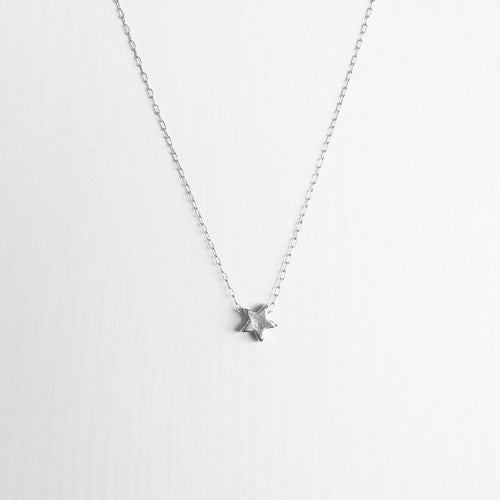 Tiny sterling silver star necklace on a delicate silver chain handmade in Australia