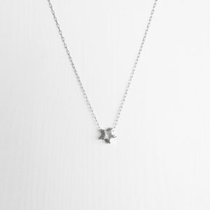 Tiny sterling silver star necklace on a delicate silver chain handmade in Australia