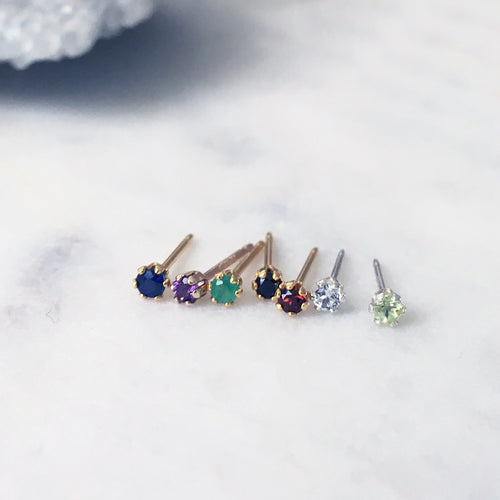 Tiny gemstone stud earrings set with blue sapphire, amethyst, emerald, red garnet, white topaz and peridot handmade in Australia